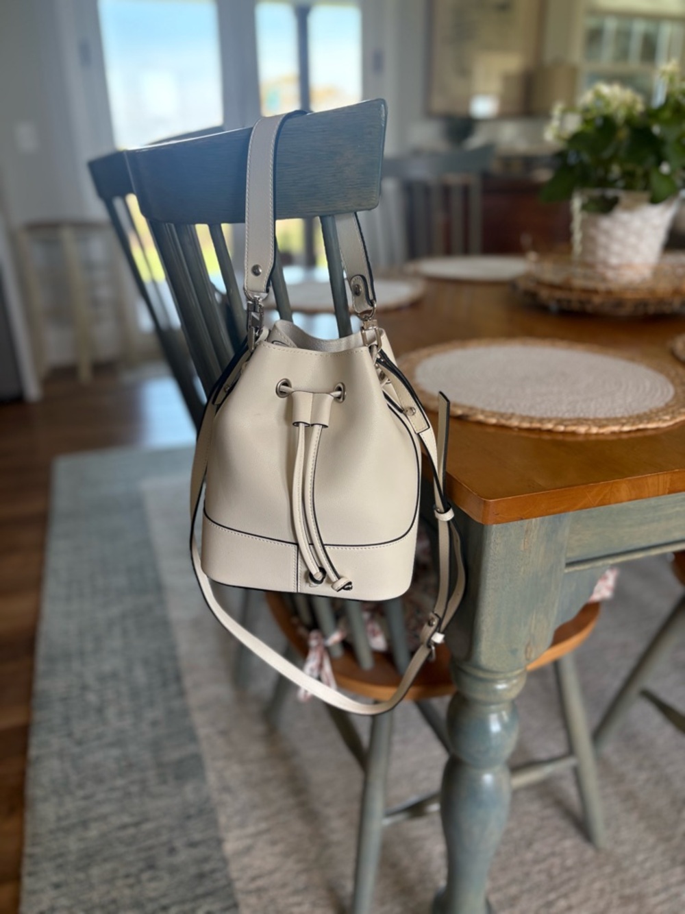 Drawstring Bucket Bag with Adjustable Strap and Top Handle. Excellent condition.